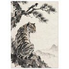 Tiger seated on a rocky ledge beneath a magpie on a pine branch, with pale mountains against a warm cream background.