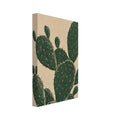 Prickly pear cactus with overlapping dark green oval pads, fine pale markings and spines against a textured beige background.