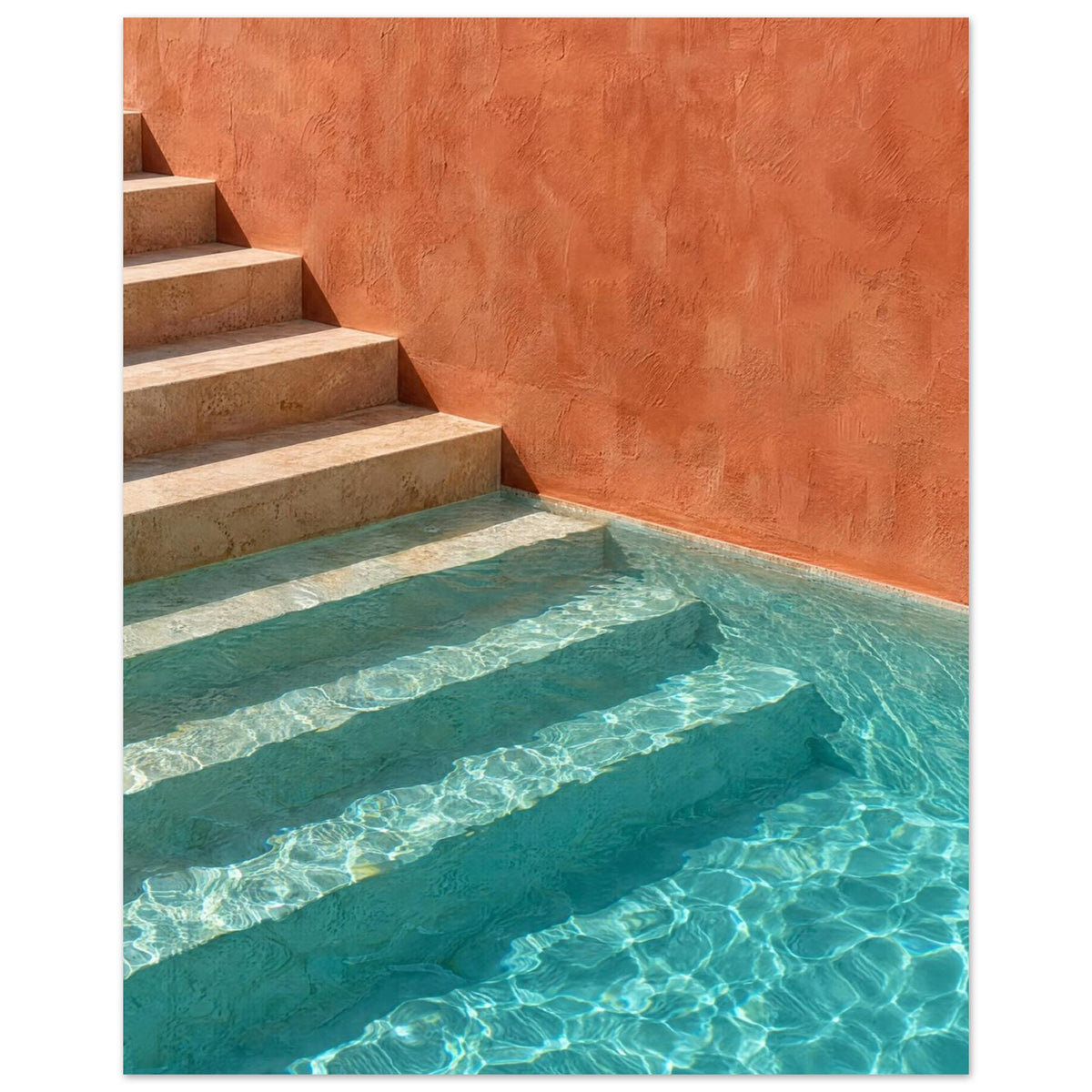 Stone steps descending into turquoise pool water beside a terracotta wall, with sunlight rippling across submerged stairs.