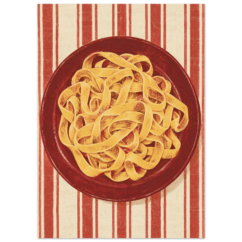 Golden pasta ribbons on a deep red plate, viewed from above against textured red and cream vertical stripes.
