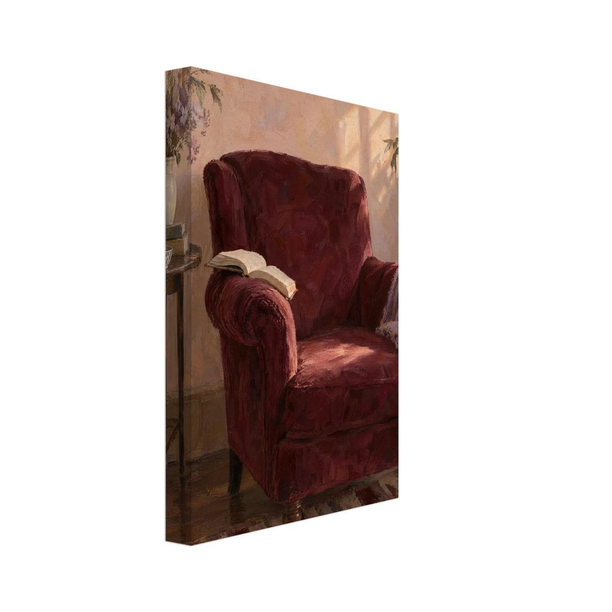 Burgundy armchair with an open book and lilac throw beside a table with flowers, books and a cup in a sunlit room.