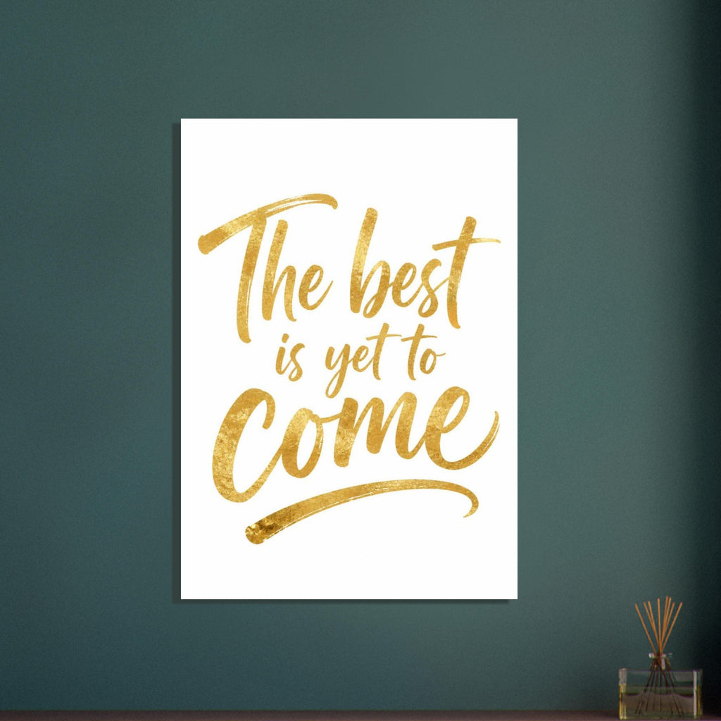 Gold-coloured script reading “The best is yet to Come” on white, with textured lettering and a sweeping underline.