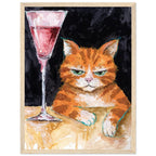 Ginger cat with green eyes resting its white paws on a golden table beside a tall glass of pink liquid, on black.