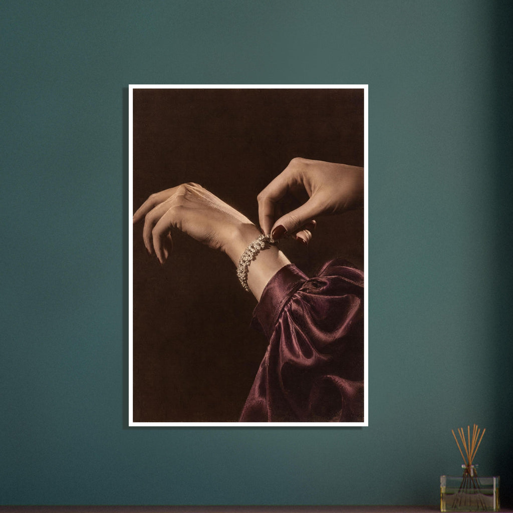 Hands adjusting a sparkling bracelet, with dark red nails and a gathered burgundy sleeve against a dark brown background.