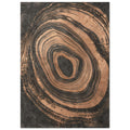 Irregular copper-toned concentric rings with distressed edges surrounding a dark centre on a textured charcoal background.