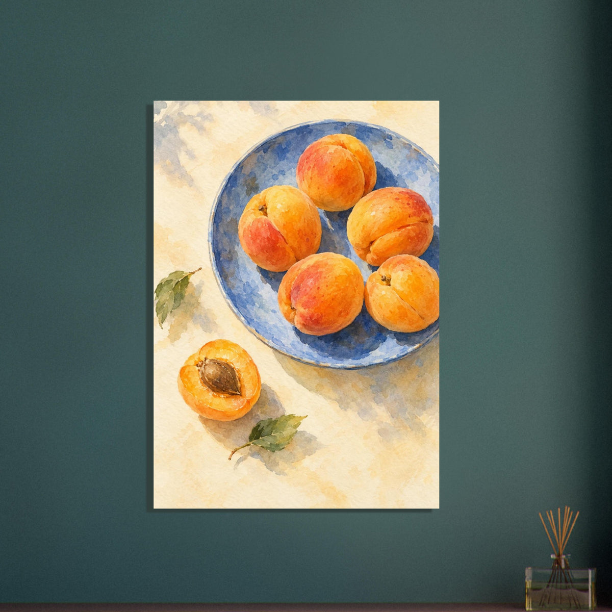 Apricots on a blue plate painted in watercolour, with a halved fruit beside the plate on a buttery cream tabletop.