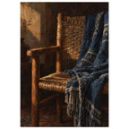 Wooden woven chair draped with a patterned blue fringed throw, painted in warm light against a dark brown interior.
