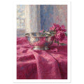 Pink flowers lean over a reflective silver bowl on folded magenta cloth, with a softly painted window behind.