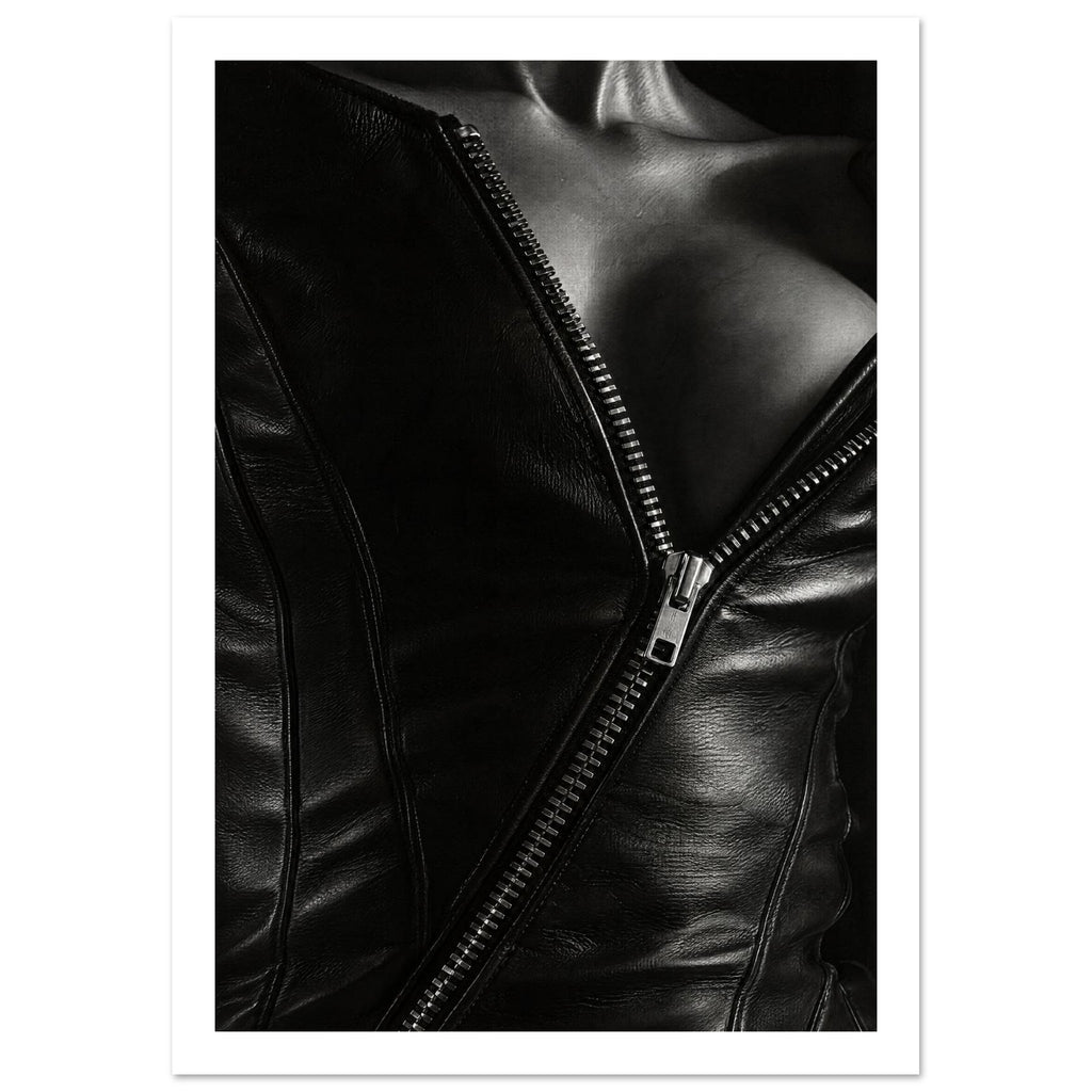 Black and white close-up of an open leather jacket with a diagonal metal zip and an exposed neckline.