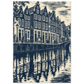 Gabled canal houses in navy and cream, with a street lamp, bicycles, an arched bridge and rippling reflections.