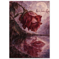 Burgundy rose above water with a lip-shaped reflection, falling droplets, a pale moon and ‘Kiss from a Rose’ text.