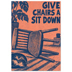 Wooden chair lying on its side beside a sleeping cat, with a plant and “Give Chairs A Sit Down” text in navy on coral.