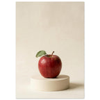 Red apple with a green leaf on a low circular cream plinth, against a cream background with soft shadows.