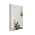 Lit ivory candle beside snow-dusted evergreen branches, with a hanging gold star and winter lettering on a cream background.