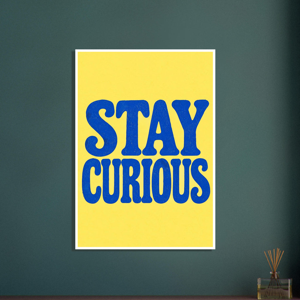 Stay Curious in large, textured blue retro lettering on two lines against a bright yellow background.