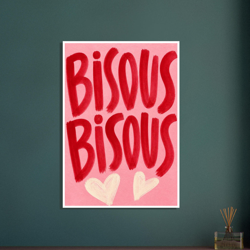 Bisous Bisous lettering in bold red brushstrokes on a pink background, with two cream hearts below.