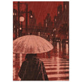 Figure beneath a pale umbrella at a rainy city crossing, with red buildings, cars and lights reflected on the street.