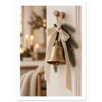 Golden bell hanging from a cream bow on a wooden peg, with evergreen sprigs and blurred candlelight behind.