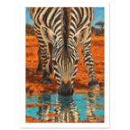 Zebra bending to drink from turquoise water, with its striped reflection below and orange earth behind.