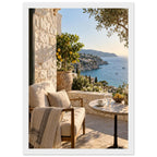Lemon tree on a stone terrace with a cushioned chair, round table and blue sea overlooking a rocky coastline.