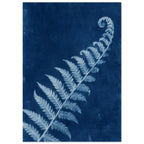 Pale blue fern frond with a curled tip extending diagonally across a textured deep blue background.