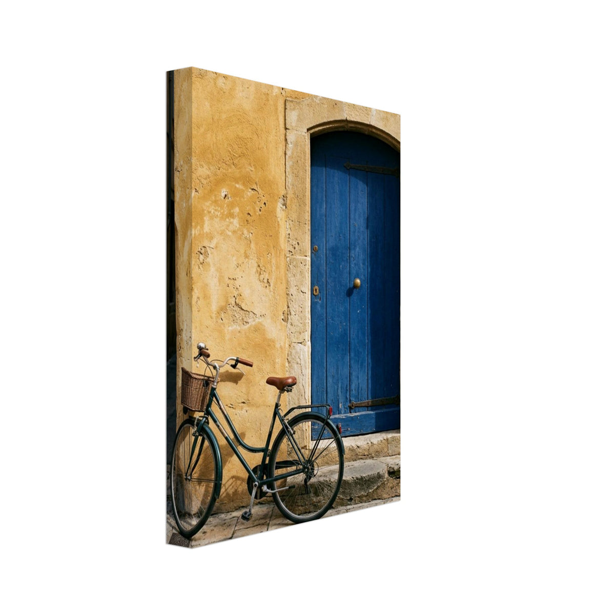 Green bicycle with a woven basket beside a blue wooden door in a golden plaster wall, above worn stone paving.