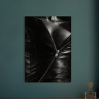 Black and white close-up of an open leather jacket with a diagonal metal zip and an exposed neckline.