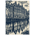 Gabled canal houses in navy and cream, with a street lamp, bicycles, an arched bridge and rippling reflections.