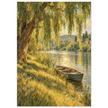 Willow tree over a sunlit river, with a wooden rowboat beside a grassy bank and houses and hills beyond.