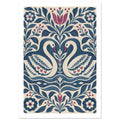 Two cream swans with blue patterned wings face each other among blue foliage and burgundy flowers on a cream background.