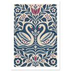 Two cream swans with blue patterned wings face each other among blue foliage and burgundy flowers on a cream background.