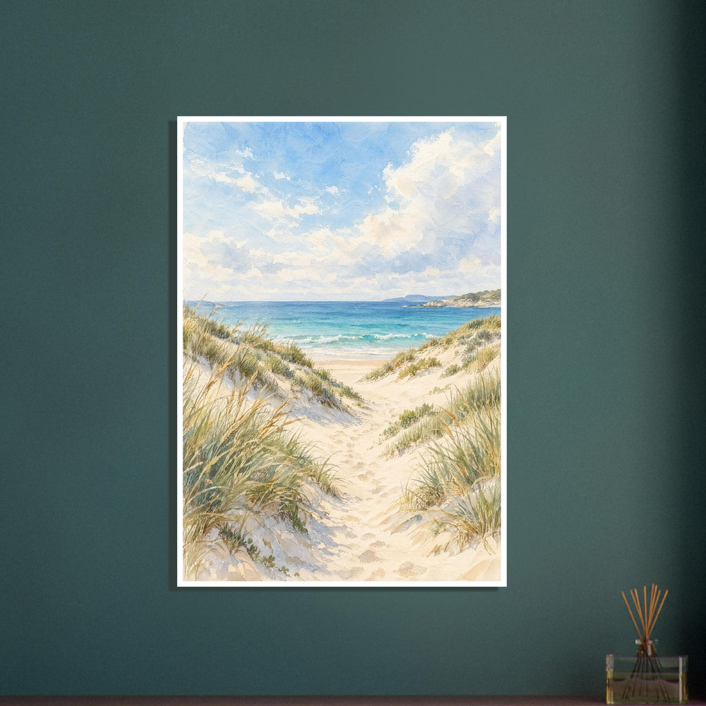 Sand dunes with grasses and footprints leading to turquoise waves beneath a blue sky with soft white clouds.
