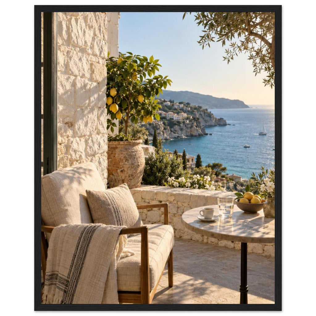 Lemon tree on a stone terrace with a cushioned chair, round table and blue sea overlooking a rocky coastline.