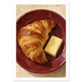 Golden croissant and a rectangular pat of butter on a burgundy plate, painted with textured brushstrokes on cream.