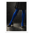Cobalt Stockings, cropped legs in blue tights and black shoes forming an angular pose against a charcoal studio background.