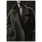 The Oversized Lapel, a chin-to-hip photograph of a model in a wool coat with a brightly outlined shoulder against charcoal sh