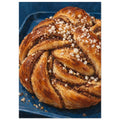 Twisted golden brown cinnamon bun topped with coarse white sugar on a deep blue tray, rendered with textured brushwork.