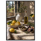 Lemons, olives, figs and a bottle of oil on a stone table beside a ceramic jug of leafy branches and a sunlit window.