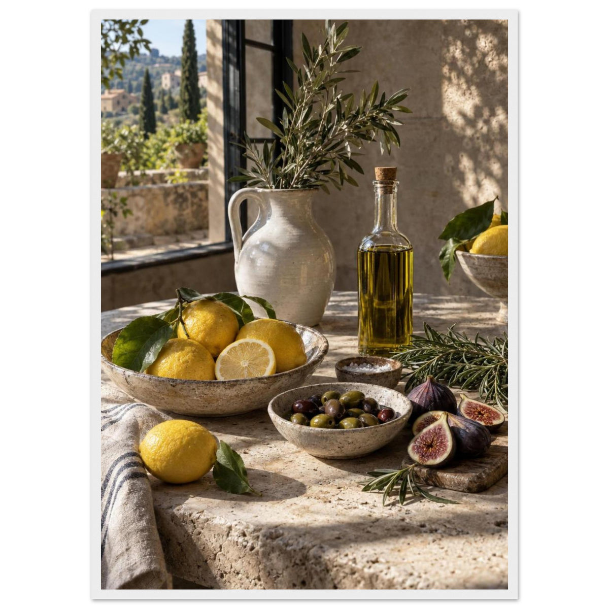 Lemons, olives, figs and a bottle of oil on a stone table beside a ceramic jug of leafy branches and a sunlit window.