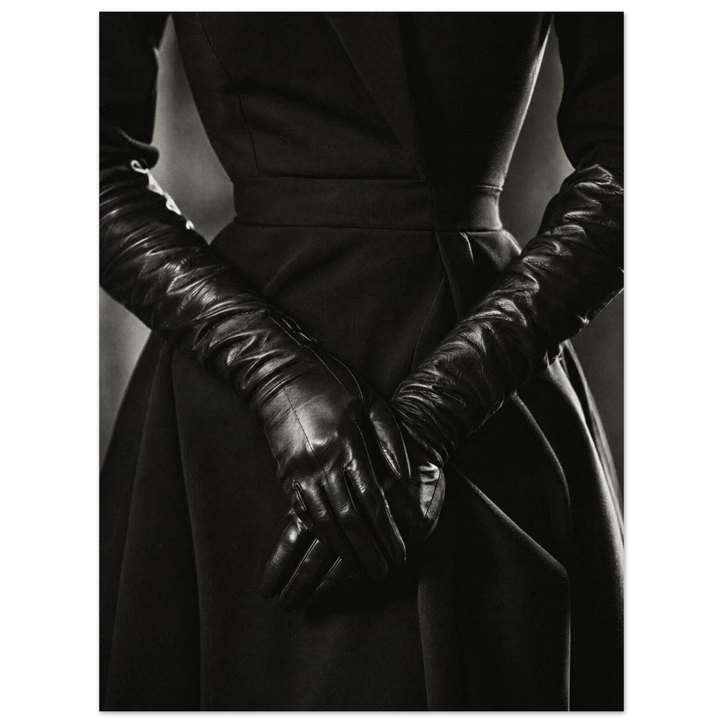 Overlapping hands in long black leather gloves against a dark fitted outfit, photographed in black and white.