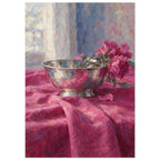 Pink flowers lean over a reflective silver bowl on folded magenta cloth, with a softly painted window behind.