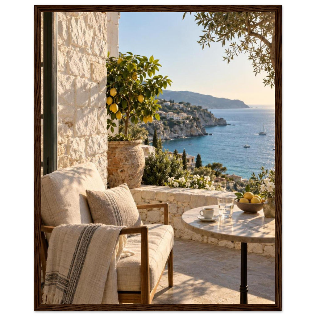 Lemon tree on a stone terrace with a cushioned chair, round table and blue sea overlooking a rocky coastline.