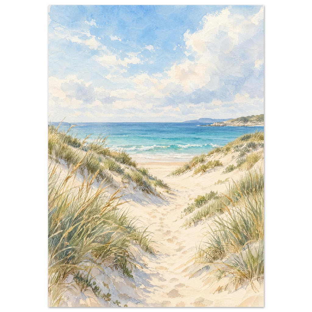 Sand dunes with grasses and footprints leading to turquoise waves beneath a blue sky with soft white clouds.