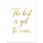 The words “The best is yet to come” in flowing gold-coloured script across three lines on a white background.