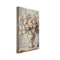 Pink and cream roses in a gold-trimmed floral vase on a gilded console table against ornate pale wall panelling.