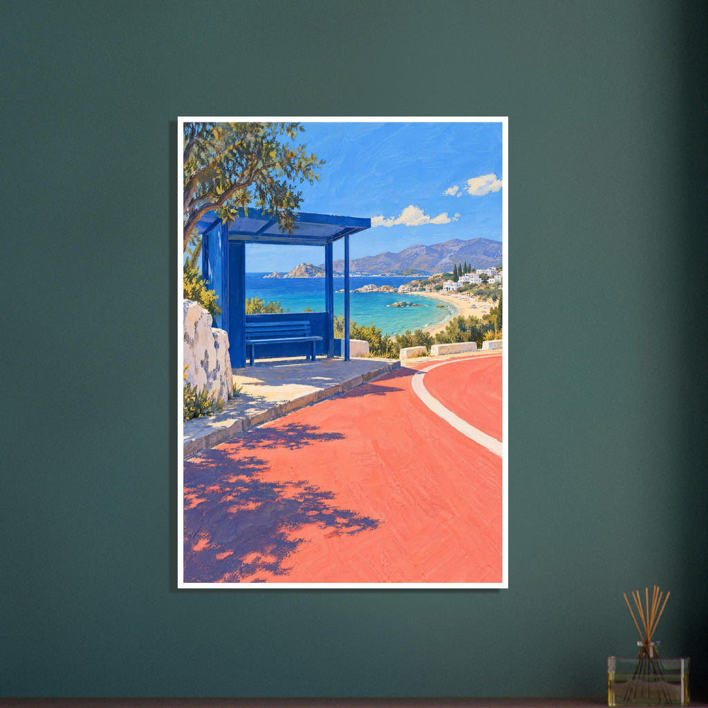 Blue bus shelter beside a coral road overlooking a turquoise bay, sandy beach, white buildings and distant mountains.