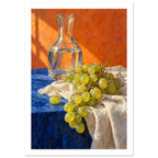 Green grapes on cream fabric beside a glass carafe of water, with a blue tabletop and textured orange background.