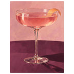 Coupe glass holding a pink cocktail with orange peel on a burgundy table against a textured pink background.