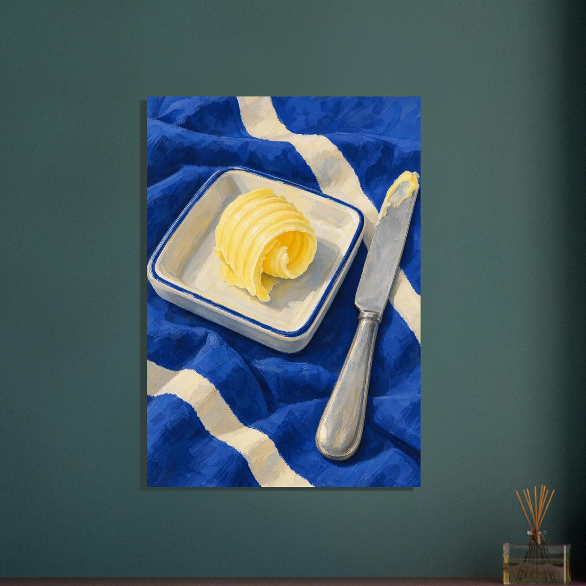 The Butter Curl still life showing a curled pat of butter on a rectangular dish beside a silver knife on cobalt cloth.