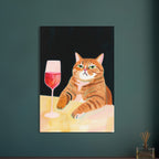Ginger tabby with green eyes resting its paws on a yellow table beside a glass of pink-red wine against a dark background.